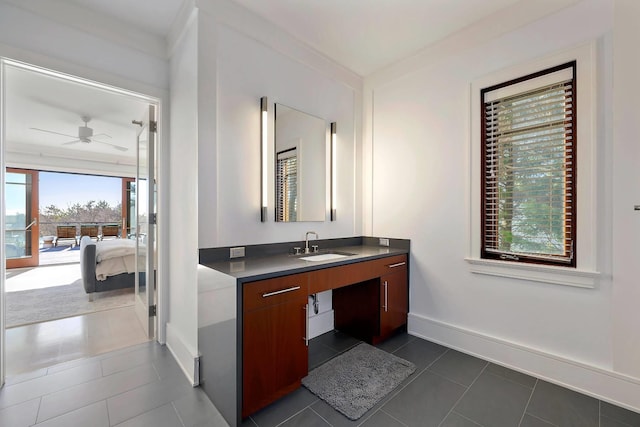 bathroom featuring ceiling fan, vanity, ornamental molding, and tile patterned flooring