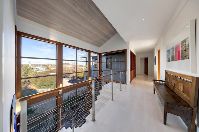 hall featuring lofted ceiling and wooden ceiling