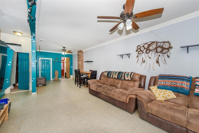 living room with ceiling fan and ornamental molding