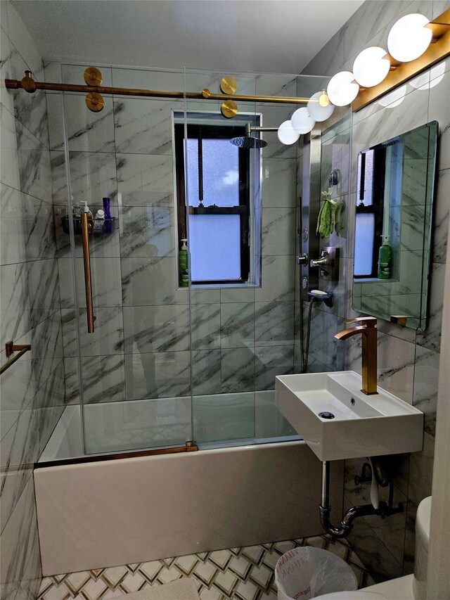 full bathroom with toilet, enclosed tub / shower combo, and sink