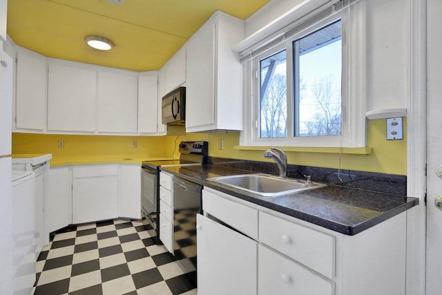 kitchen featuring white cabinetry, sink, and black appliances