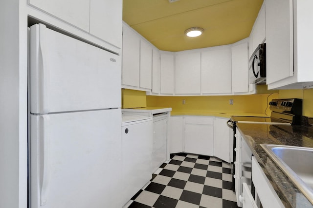 kitchen with white cabinetry, sink, white fridge, and range with electric cooktop