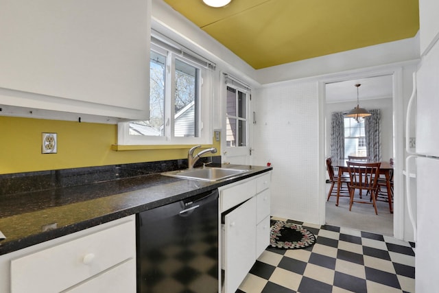 kitchen featuring sink, dishwasher, hanging light fixtures, white cabinets, and white fridge