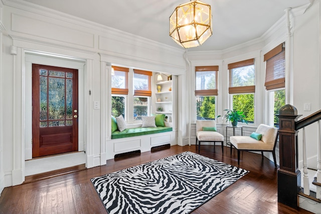 sunroom featuring an inviting chandelier