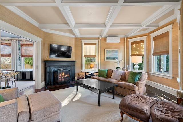 living room with beam ceiling, coffered ceiling, hardwood / wood-style flooring, a wall mounted air conditioner, and a healthy amount of sunlight