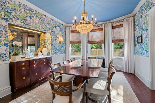 dining space with a chandelier, dark wood-type flooring, and ornamental molding