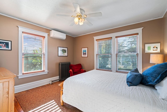 bedroom featuring radiator, hardwood / wood-style flooring, a wall mounted AC, ceiling fan, and crown molding