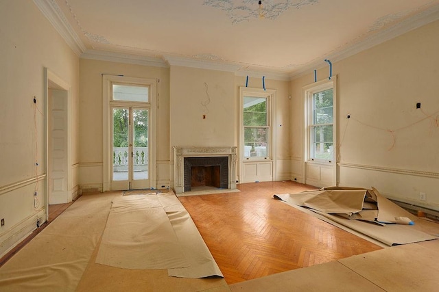 interior space with light parquet floors and ornamental molding