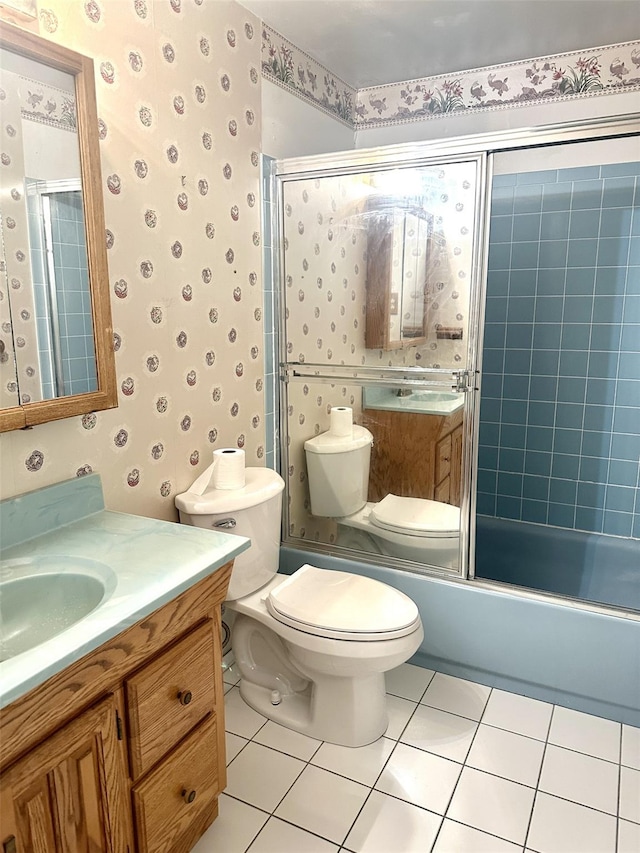 full bathroom with toilet, tile patterned flooring, enclosed tub / shower combo, and vanity