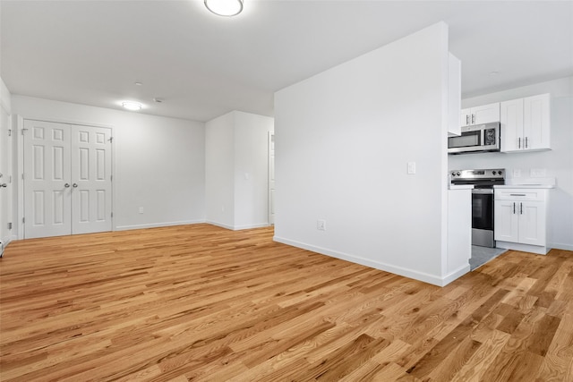 unfurnished living room featuring light hardwood / wood-style floors