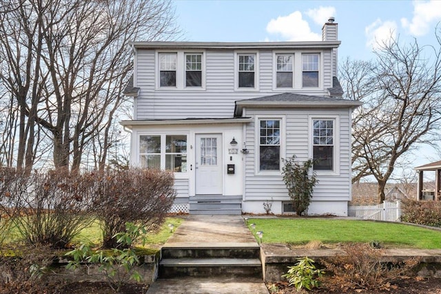 view of front of house with a front lawn