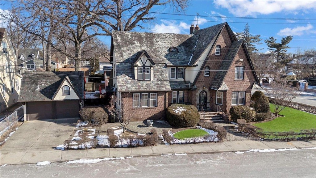 tudor home featuring a garage