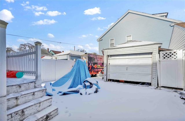 exterior space with a garage and an outdoor structure