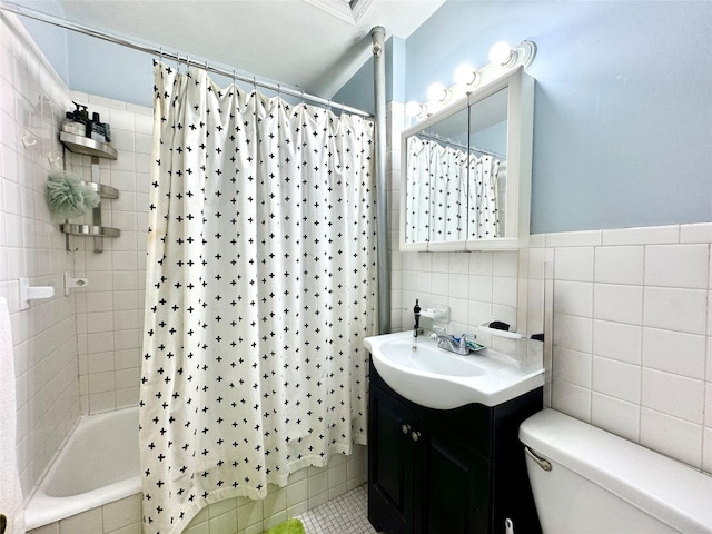 full bathroom featuring shower / bathtub combination with curtain, tile walls, toilet, tile patterned floors, and vanity