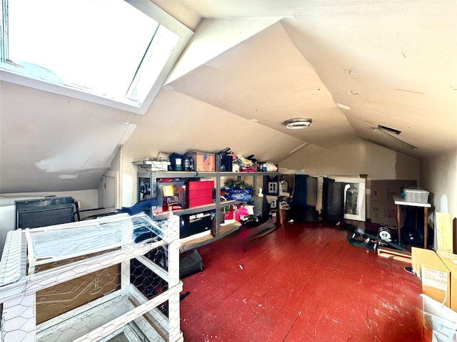 bonus room featuring vaulted ceiling with skylight