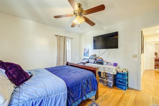 bedroom featuring ceiling fan and light hardwood / wood-style floors