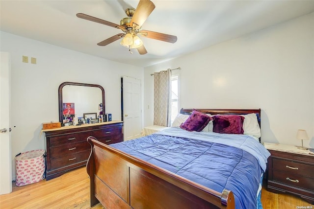 bedroom featuring light wood-type flooring and ceiling fan