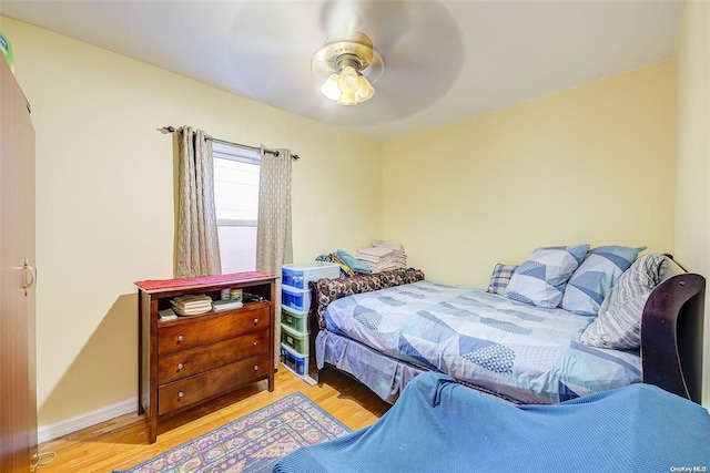 bedroom featuring ceiling fan and light hardwood / wood-style floors