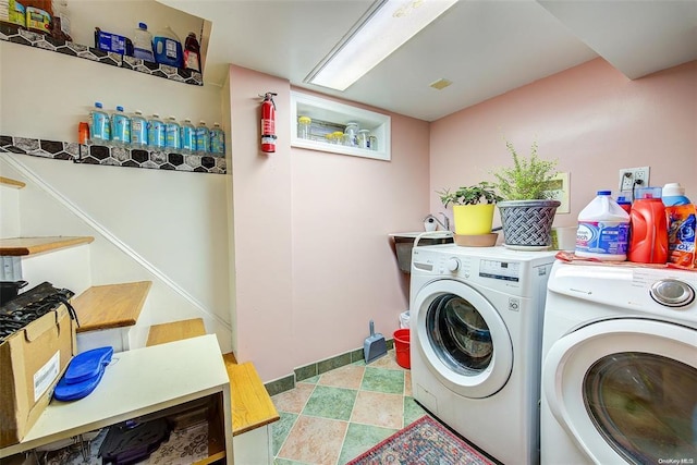 clothes washing area featuring washer and clothes dryer