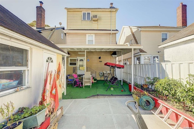 rear view of property with a patio area