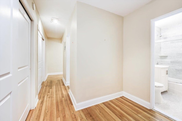 hallway with light wood-type flooring