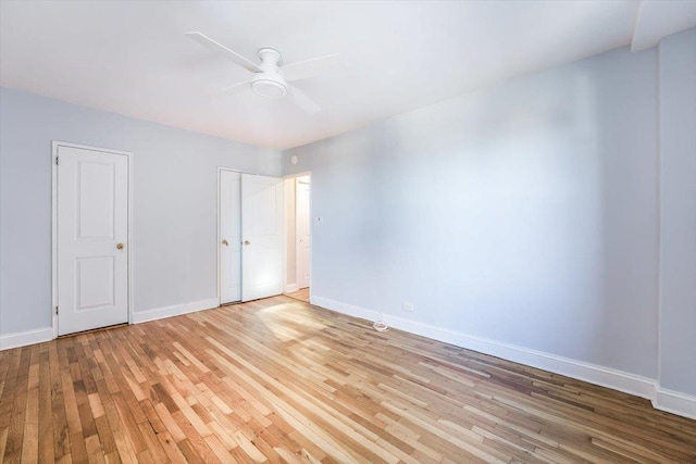 unfurnished room with ceiling fan and light hardwood / wood-style floors