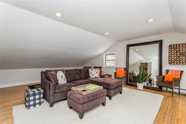 living room with lofted ceiling and wood-type flooring