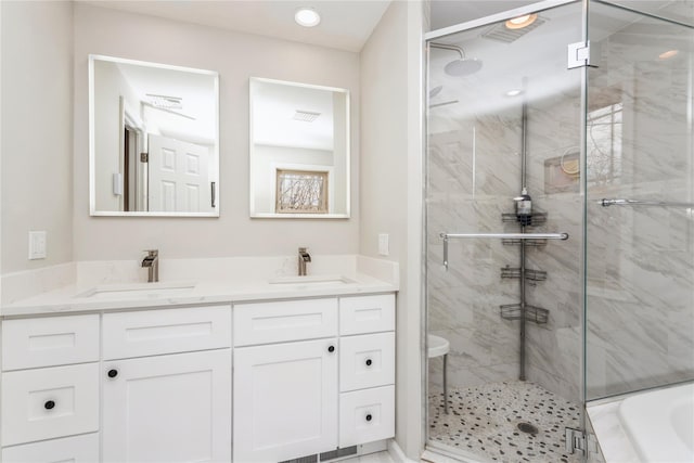 bathroom featuring independent shower and bath and vanity