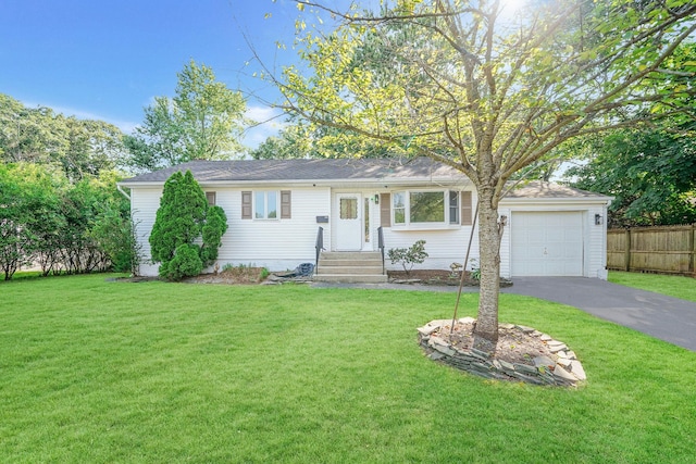 single story home with a garage and a front lawn