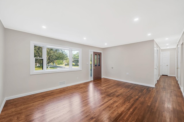 empty room featuring dark hardwood / wood-style floors