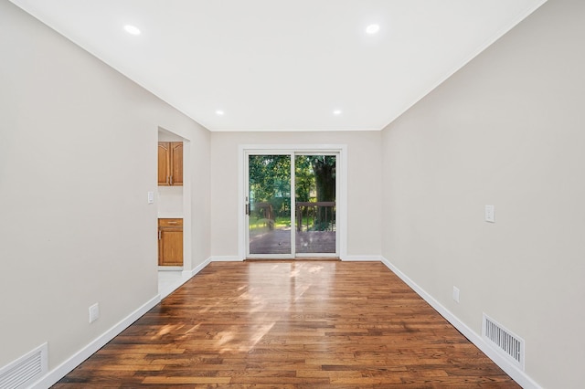 spare room featuring hardwood / wood-style floors