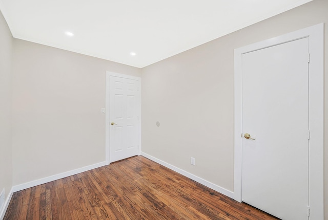 unfurnished room featuring dark hardwood / wood-style floors