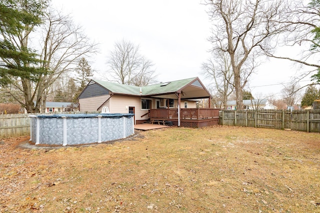 view of yard with a swimming pool side deck