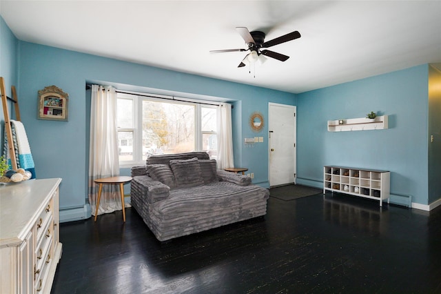 bedroom featuring ceiling fan and a baseboard heating unit