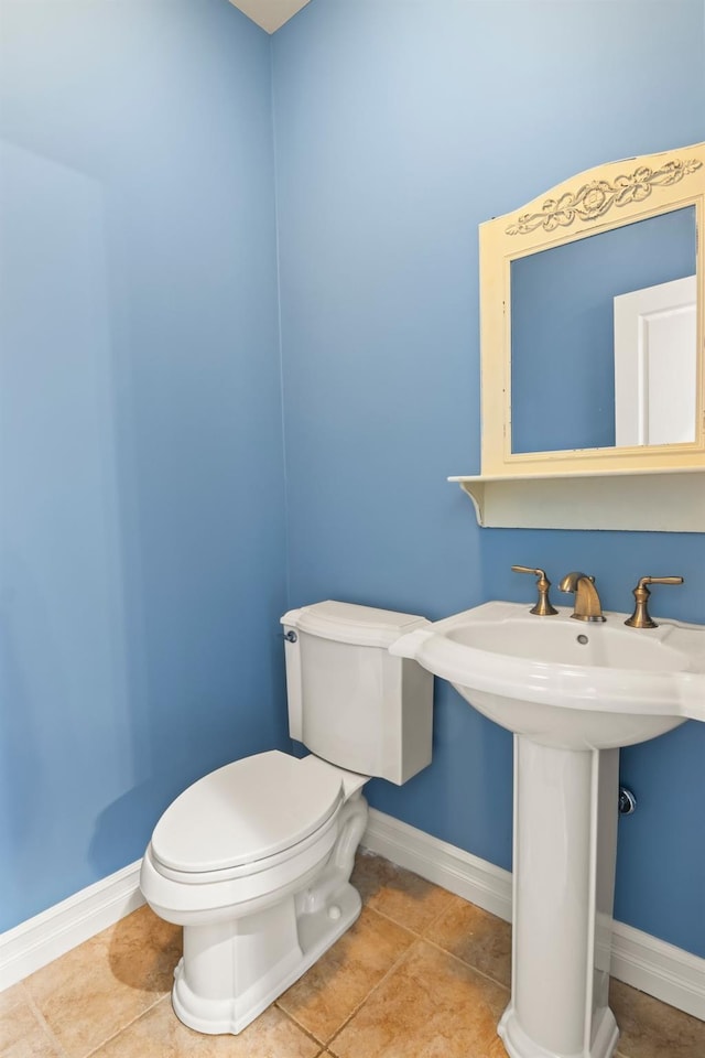 bathroom featuring toilet and tile patterned floors