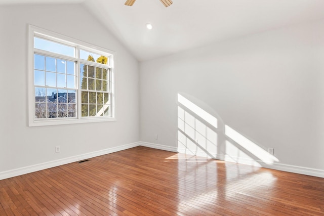 unfurnished living room featuring ceiling fan, plenty of natural light, wood-type flooring, and lofted ceiling