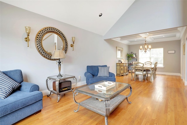 living room featuring an inviting chandelier and light hardwood / wood-style floors