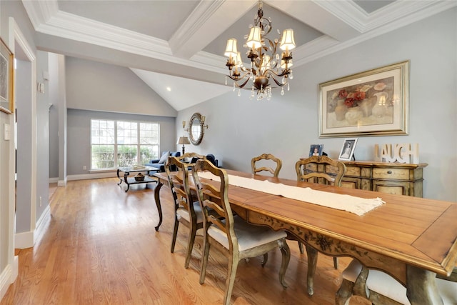 dining room featuring light wood-type flooring, ornamental molding, beam ceiling, and an inviting chandelier