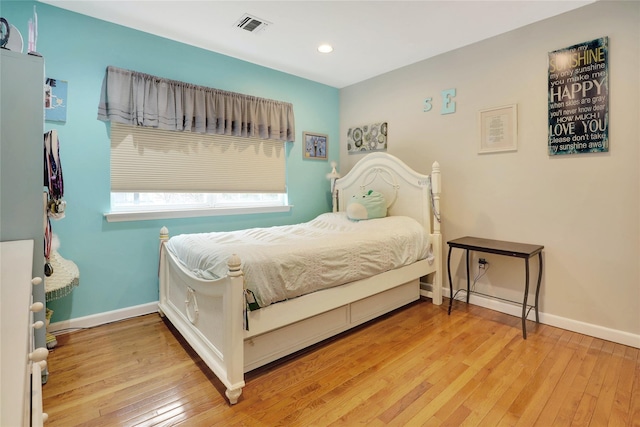 bedroom with hardwood / wood-style flooring