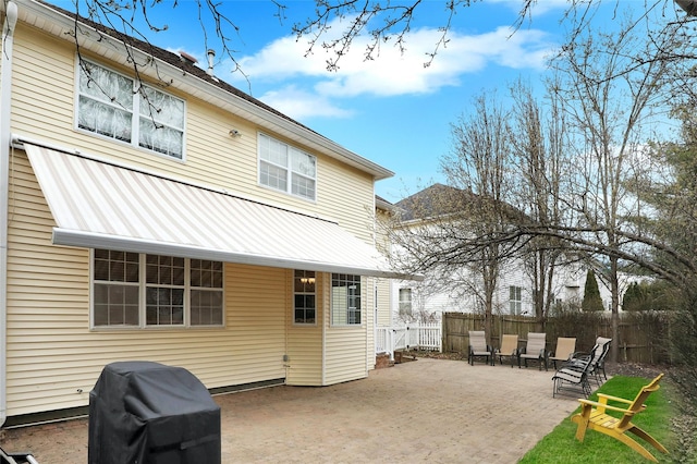 back of house with a patio area