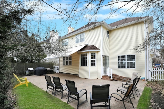 rear view of house with a patio area