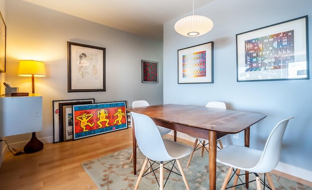 dining area featuring light wood-type flooring