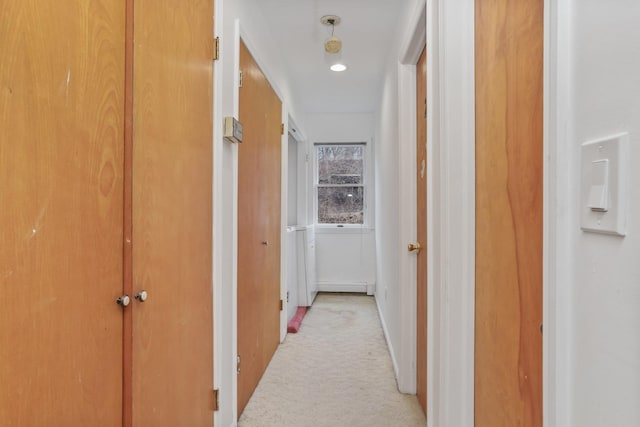 hallway featuring light carpet