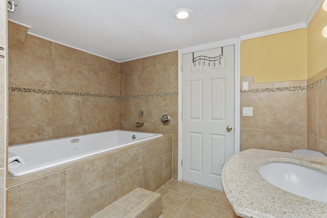 bathroom with tiled tub, ornamental molding, tile walls, and tile patterned floors