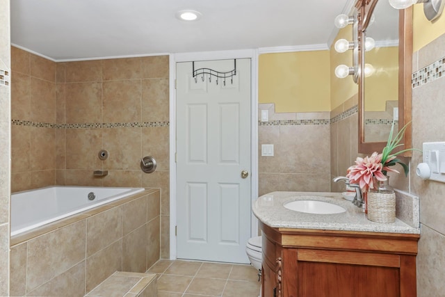 bathroom with ornamental molding, tile patterned floors, tile walls, and vanity