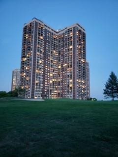 view of outdoor building at dusk