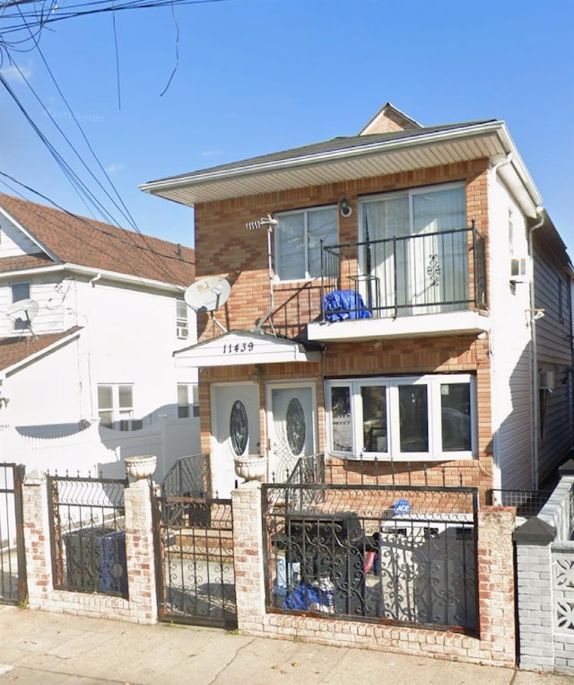 view of front of house with a balcony