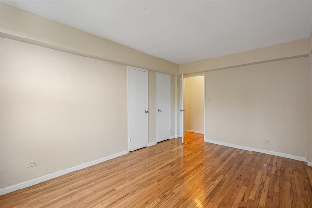 unfurnished room featuring light hardwood / wood-style floors