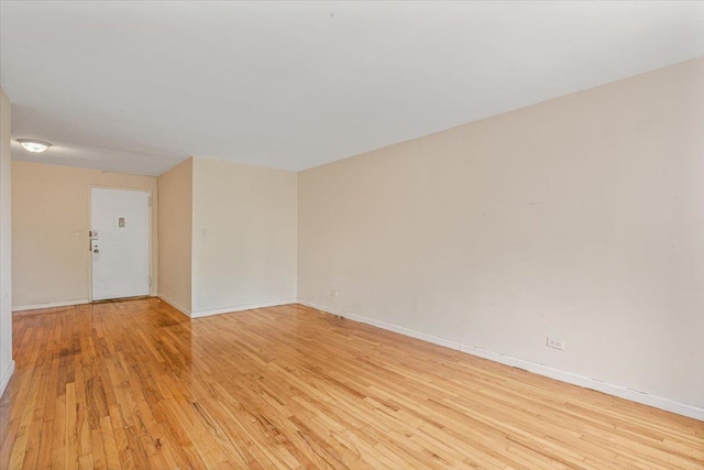 unfurnished room with light hardwood / wood-style floors