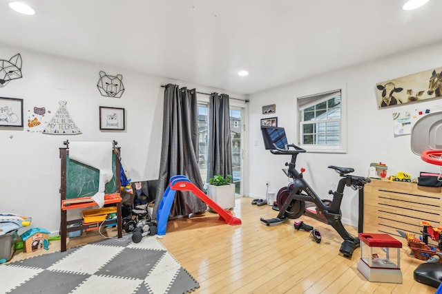 workout area featuring hardwood / wood-style floors